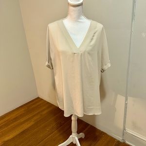 Versatile, silky, cream blouse